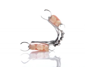 46802056 - false teeth placed on white background.